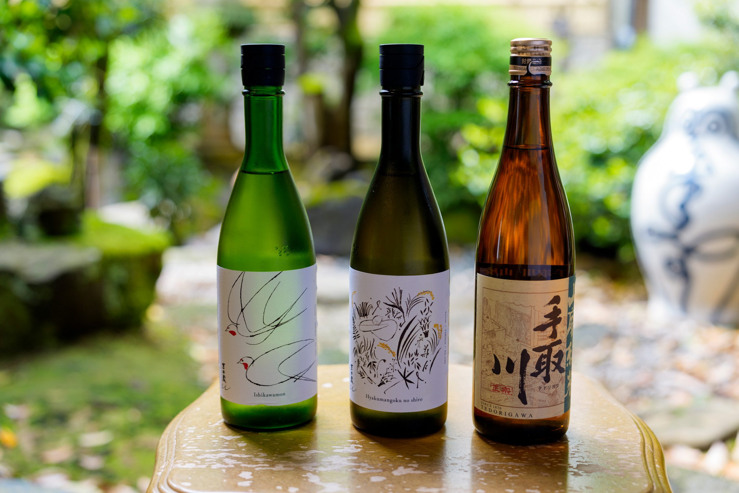 From the left, "Yoshida warehouse u  Ishikawa gate" "Yoshida warehouse u  Hyakumangoku Noshiro" and "Tedori-gawa  Yamahai preparing ingredients for the brewing process  Junmai Sake". 720 ml for each