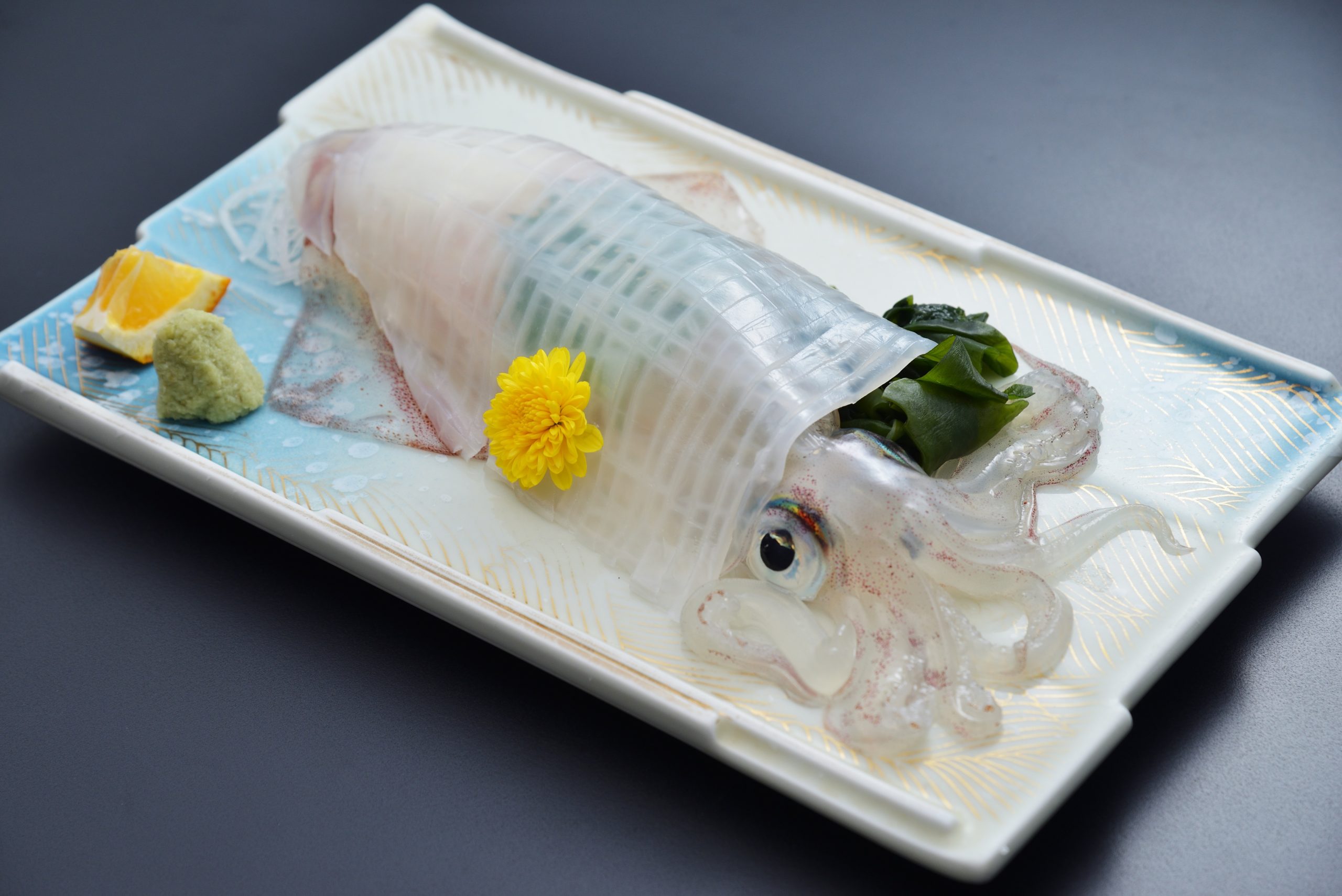  The restaurant’s most popular item is “live squid.”