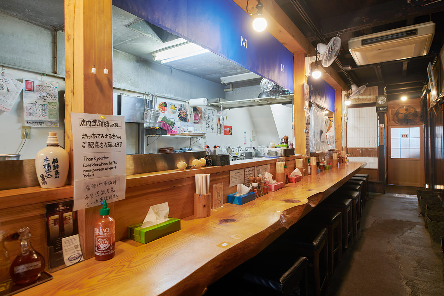  The ordering system involves purchasing meal tickets. There are also raised seating areas in the back