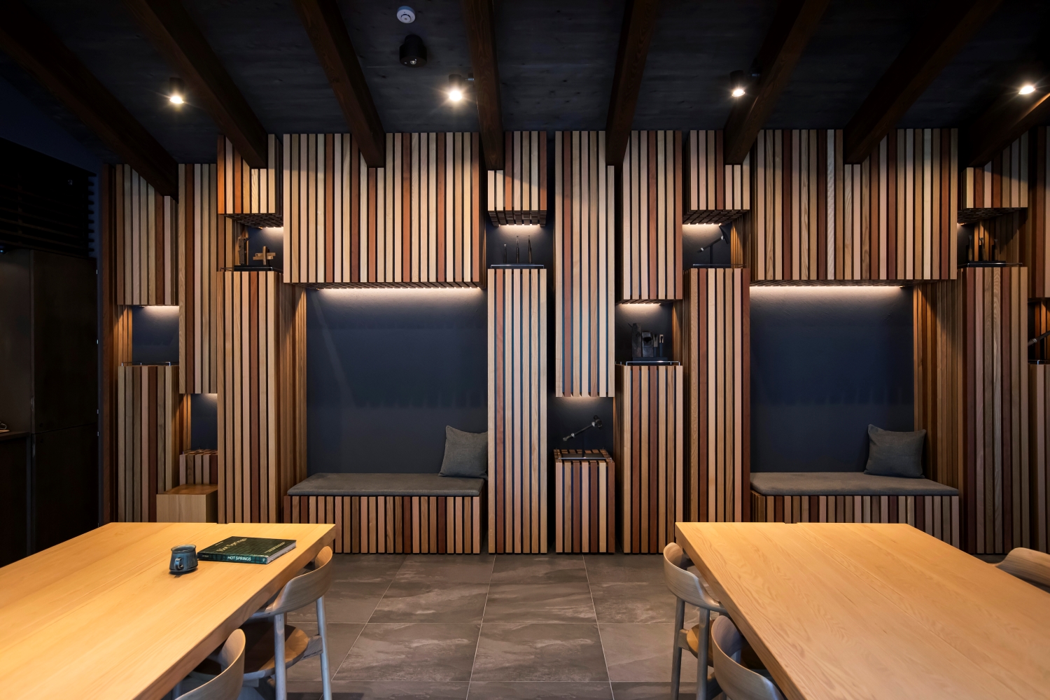  The walls, designed to evoke the forests of Hida, feature a display of well-worn woodworking tools